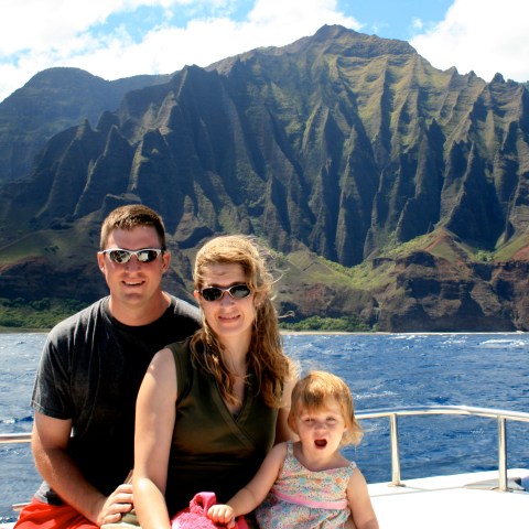 A family sitting on the boat