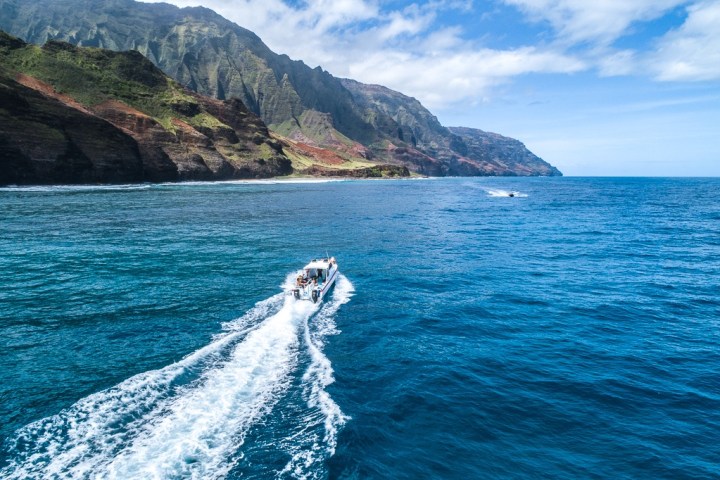 a body of water with a mountain in the background