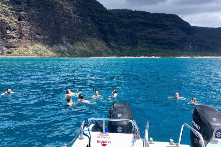 a group of people on a boat in a body of water